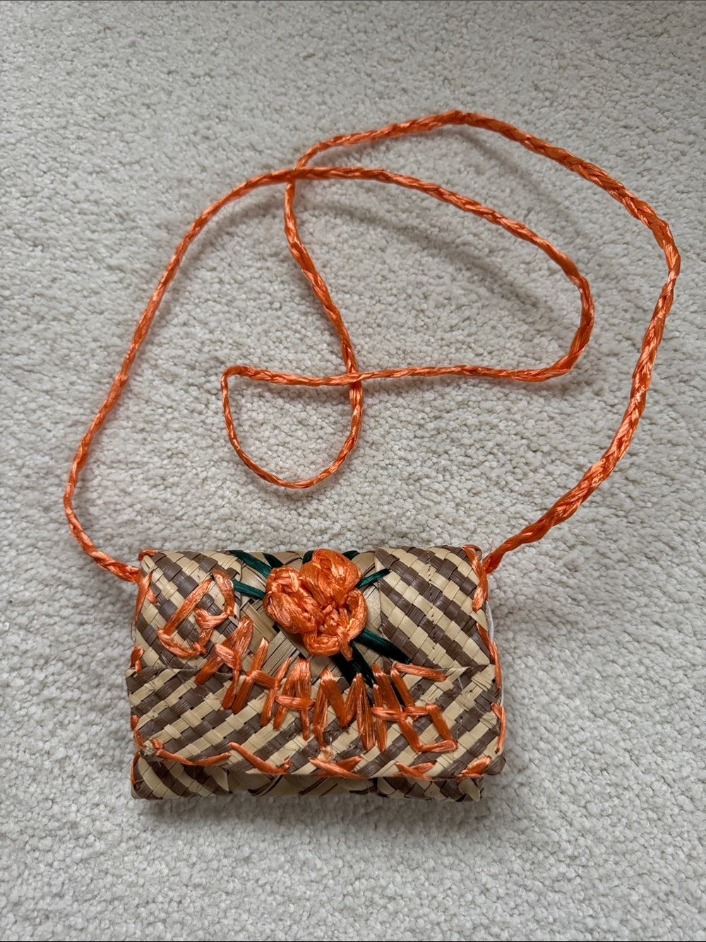 Handwoven Straw Crossbody Bag with Orange Floral Detail